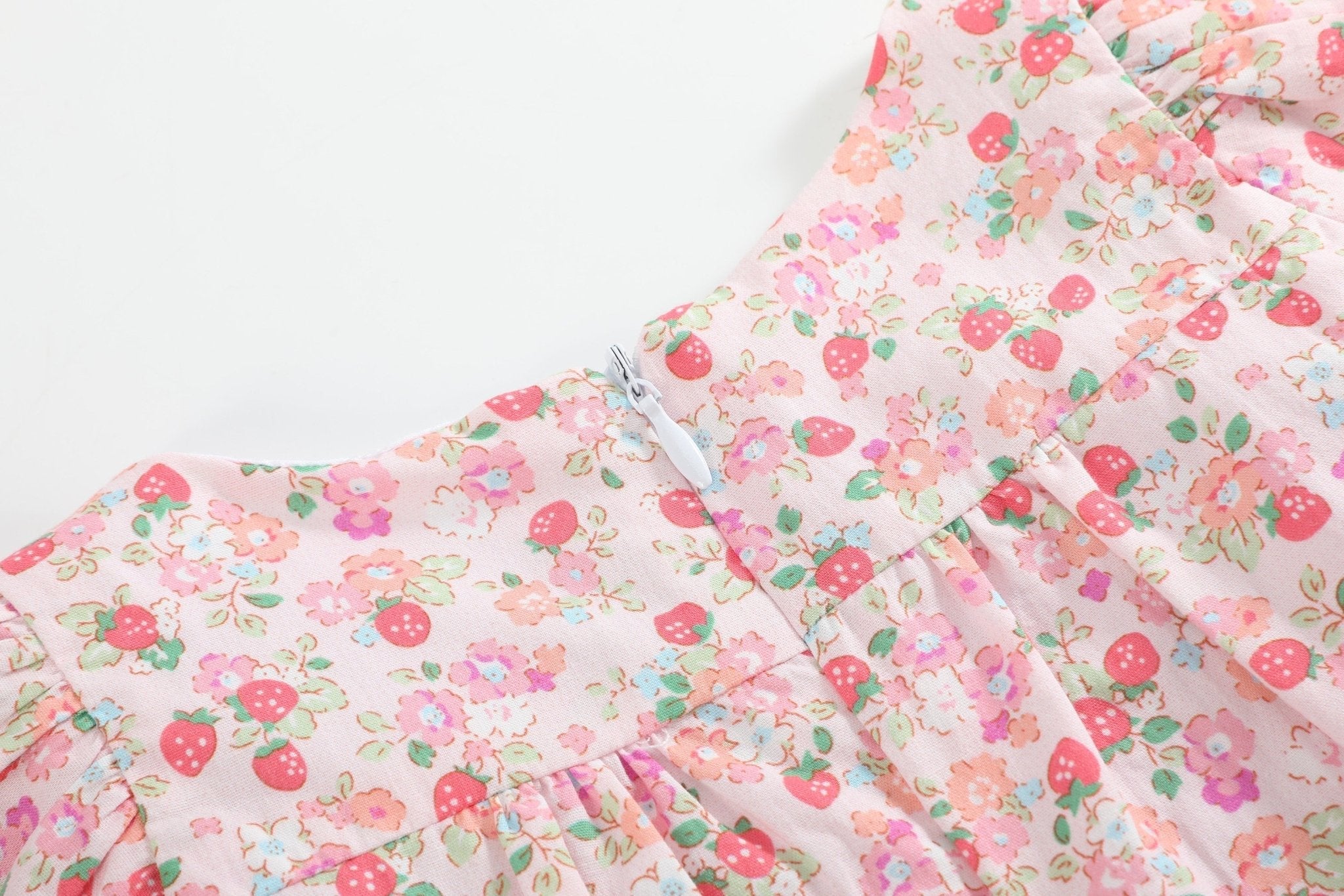 Pink strawberry floral kids dress with concealed back zipper, back neckline close-up
