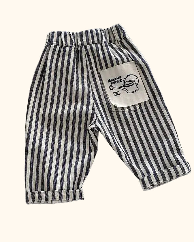 Striped kids tapered trousers with graphic back patch pocket and rolled cuffs, back view
