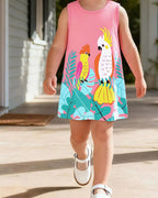 Blush pink kids tropical parrot print sleeveless dress worn by child, front lifestyle view