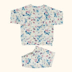 Ivory butterfly floral crew neck pocket top and matching kids jogger pants, flat lay front view
