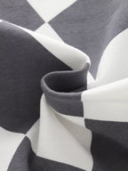Black-and-white kids diamond print shorts fabric, material close-up