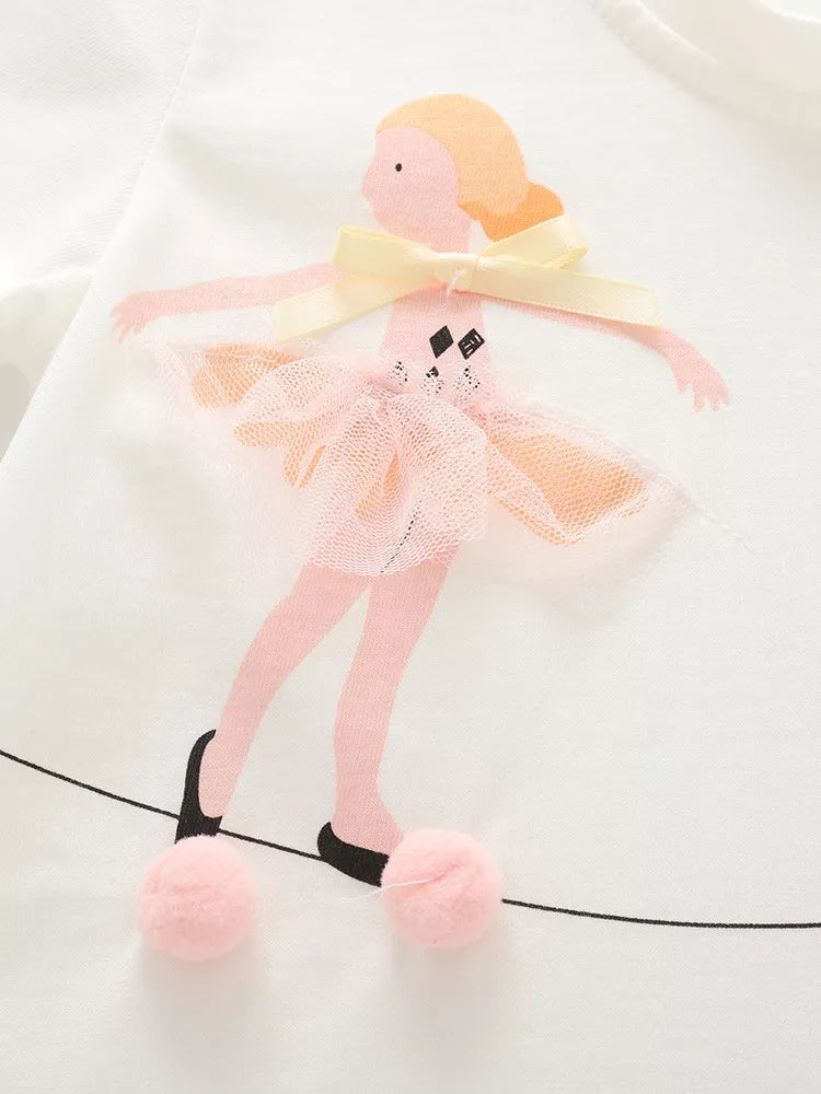 White kids T-shirt with ballet dancer, pink tulle tutu, cream bow and pom-poms, design close-up