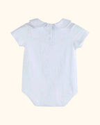 White organic cotton baby bodysuit with back snap placket, back view