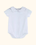 White organic cotton baby bodysuit with Peter Pan collar and short sleeves, front view