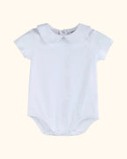 White organic cotton baby bodysuit with Peter Pan collar and short sleeves, front view