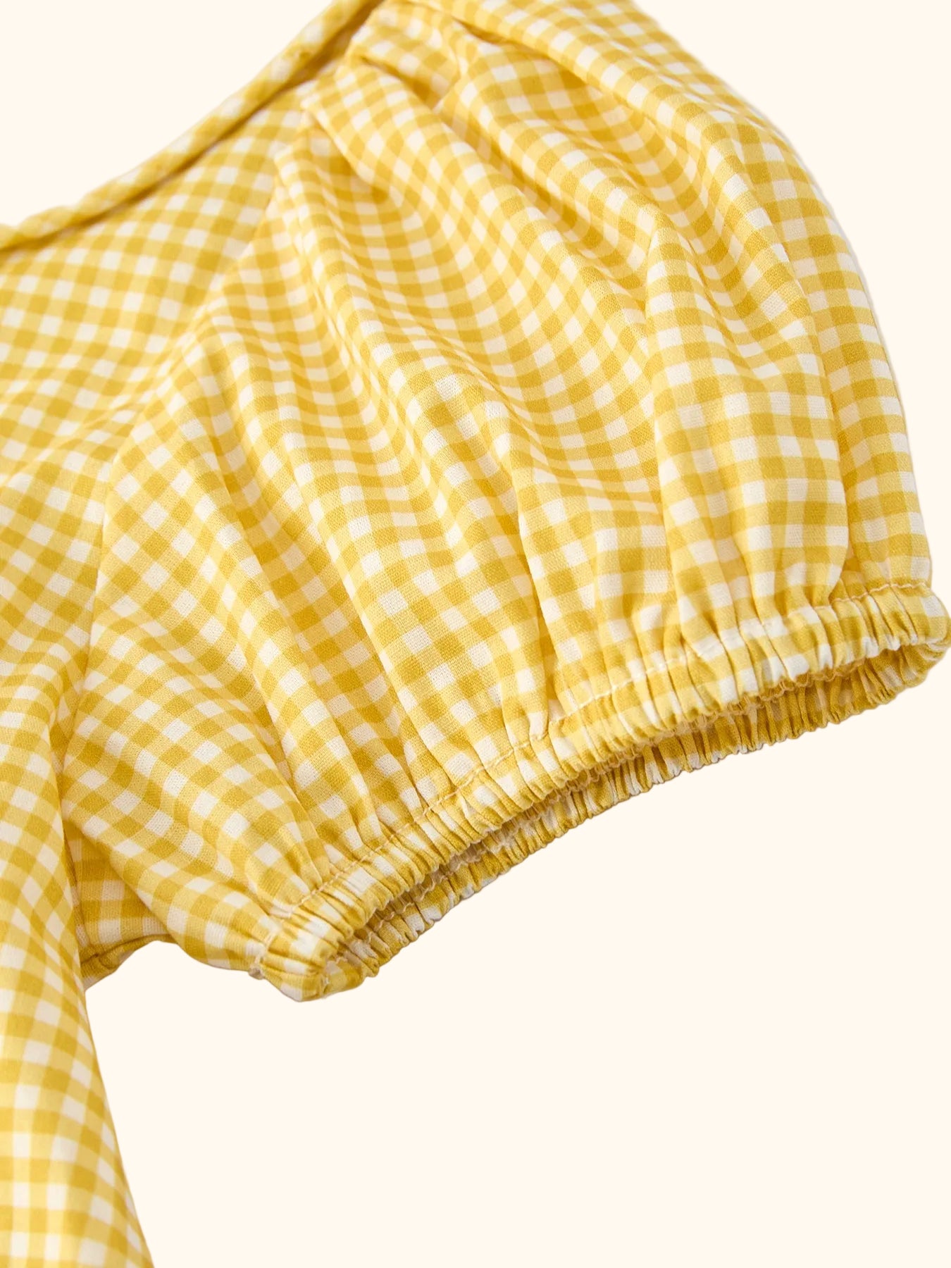 Yellow gingham kids smocked goose dress with gathered skirt, full front view