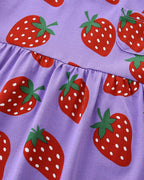 Purple kids strawberry print dress with gathered waist seam, close-up detail view