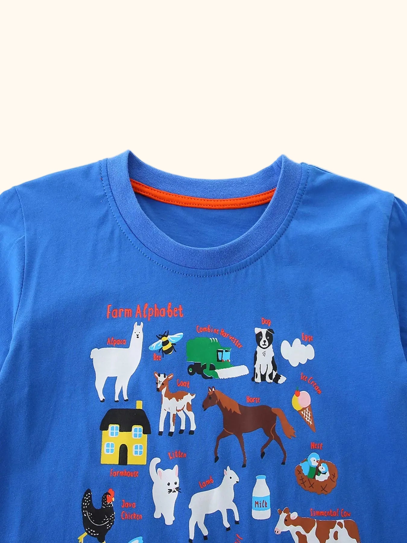 Blue kids farm alphabet T-shirt with colorful animal and farm graphic, front detail