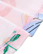 Blush pink kids butterfly print dress with finished interior seam, fabric detail view