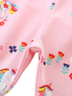 Blush pink kids unicorn print pants with rainbow unicorn and floral pattern, fabric detail view
